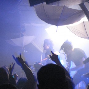 Shiny Toy Guns Hiding Behind Smoke and Lights